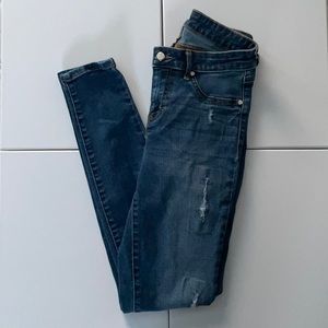 Dark ripped Jennifer Lopez super skinny jeans